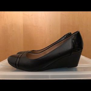 Black patent, flat, and textured leather wedges